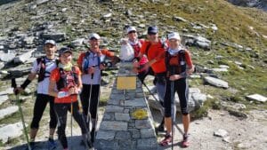 Training plans and strategies for an ultra trail 4 Training plans and strategies for an ultra trail Endurance Trail Runner on the Tor des Geants with a Stone Pyramid Atop the Hil